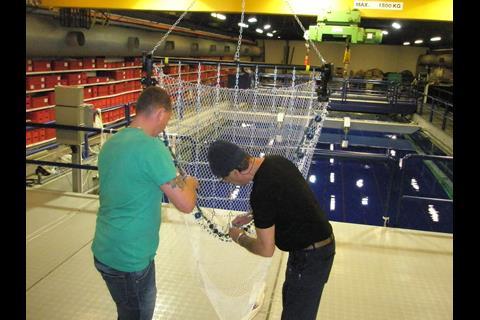 Alterations are made to a beam trawl before shooting it in the flume tank again